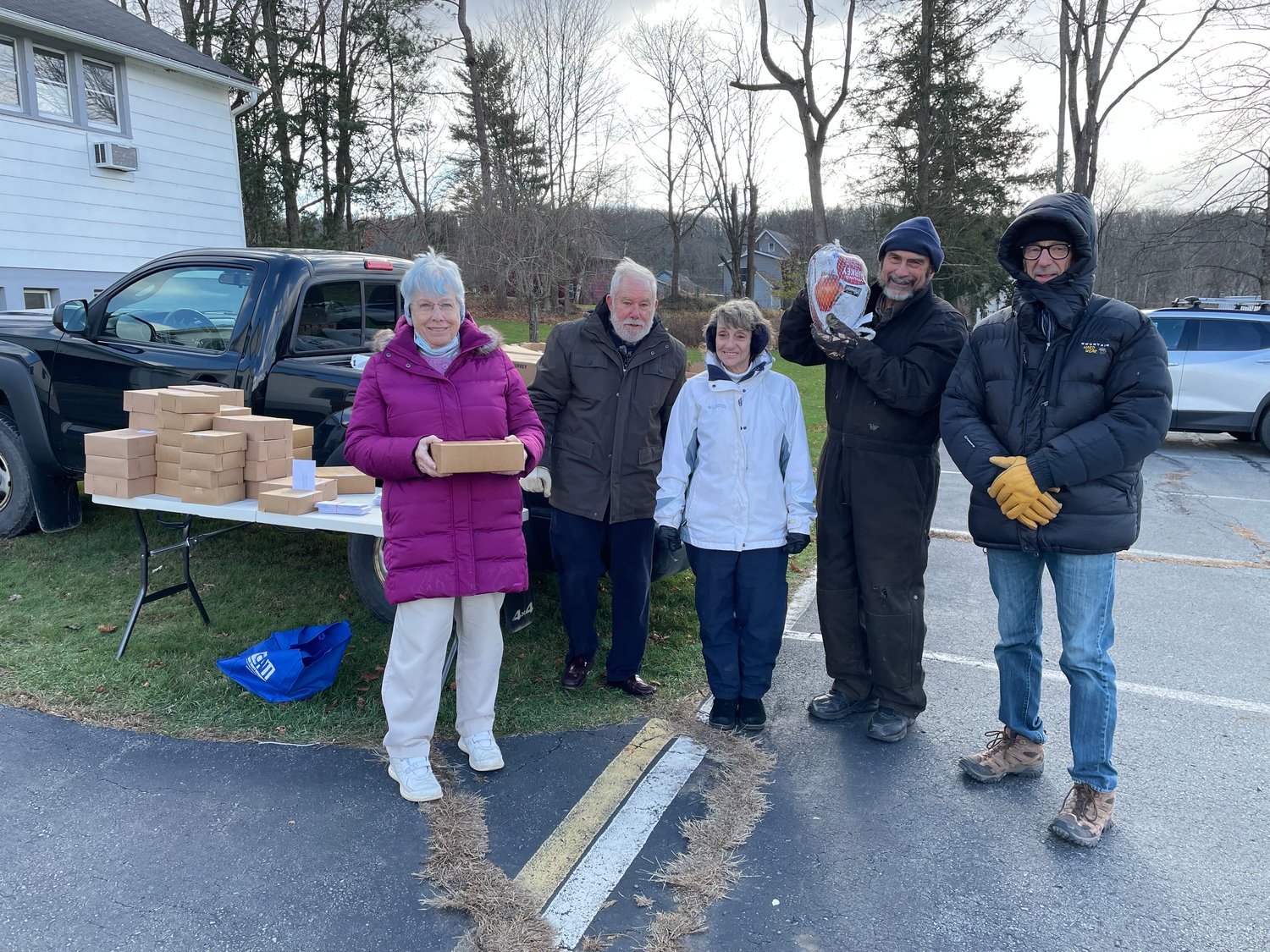 Volunteers from the Ecumenical Food Pantry prepare to distribute Thanksgiving turkeys and pies to members of the community. Beach Lake Bakery donated the pies. The turkeys were donated by Ned Lang.